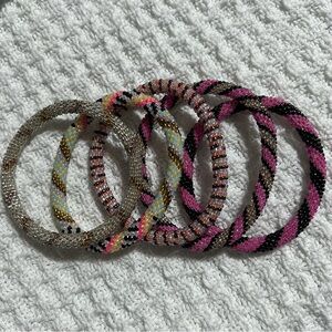 5 Sashka Co handcrafted beaded bracelets. Pink accents. Approx 8”.